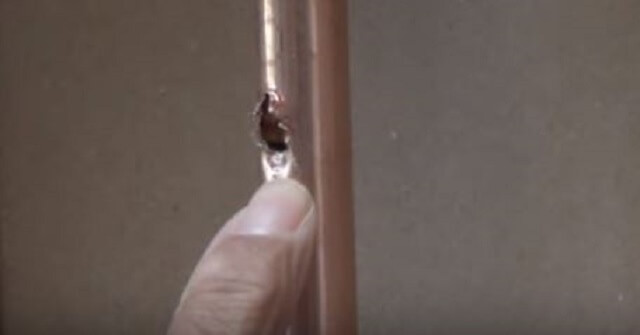 Plumbing problems: Image shows a section of copper piping that burst due to freezing temperatures.